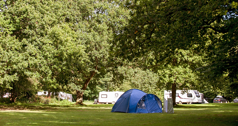 Mature taking a campsite shower